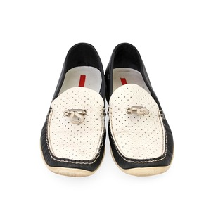 https://dbiyorq10n2b9.cloudfront.net/product-images/CSHOPRA0047/PRADA-Leather-Loafers-BlackWhite-S-37-4-front.jpg.webp