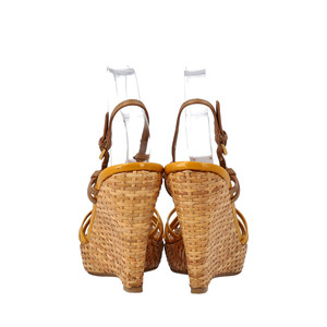 https://dbiyorq10n2b9.cloudfront.net/product-images/CSHOPRA0140/PRADA-Leather-Patent-Raffia-Wedge-Sandals-Beige-Yellow_2.jpg.webp