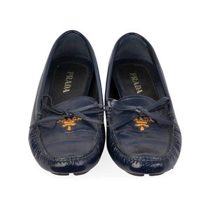 https://dbiyorq10n2b9.cloudfront.net/product-images/CSHOPRA158/PRADA-Patent-Leather-Driving-Loafers-Blue-S-36-3-front.jpg.webp