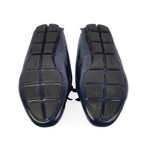 https://dbiyorq10n2b9.cloudfront.net/product-images/CSHOPRA158/PRADA-Patent-Leather-Driving-Loafers-Blue-S-36-3-soles.jpg.webp