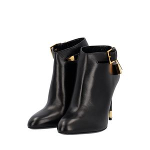 https://dbiyorq10n2b9.cloudfront.net/product-images/CSHOTF0033/TOM-FORD-Leather-Padlock-Ankle-Boots-Black_2.jpg.webp