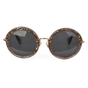 https://dbiyorq10n2b9.cloudfront.net/product-images/CSUNMIU111/MIU-MIU-Round-Sunglasses-SMU-13N-Glitter-front.jpg.webp