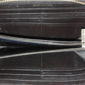 https://dbiyorq10n2b9.cloudfront.net/product-images/CWALBUR113/BURBERRY-Leather-Studded-Zip-Around-Wallet-Brown-interior.jpg.webp