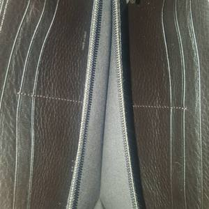 https://dbiyorq10n2b9.cloudfront.net/product-images/CWALFEN0001/FENDI-Zucca-Zippy-Wallet-Brown-interior.jpg.webp