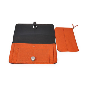 https://dbiyorq10n2b9.cloudfront.net/product-images/CWALHER0001/HERMES-Leather-Dogon-Duo-Wallet-OrangeBlack-open.jpg.webp