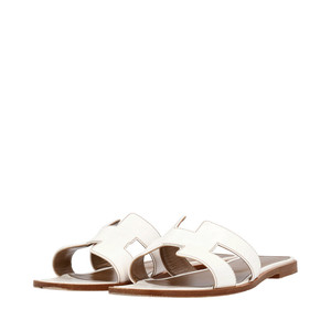 https://dbiyorq10n2b9.cloudfront.net/product-images/SHOHER0008/HERMES-Leather-Oran-Sandals-White_2.jpg.webp