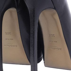 https://dbiyorq10n2b9.cloudfront.net/product-images/SHOYSL101/YVES-SAINT-LAURENT-Vernigolf-Tribtoo-Platform-Pumps-Black-5.jpg.webp